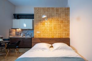 Postelja oz. postelje v sobi nastanitve Wine Inn Borjomi Aparthotel