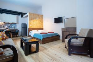 TV in/ali zabaviščno središče v nastanitvi Wine Inn Borjomi Aparthotel