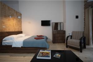 Postelja oz. postelje v sobi nastanitve Wine Inn Borjomi Aparthotel