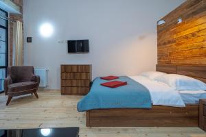 Postelja oz. postelje v sobi nastanitve Wine Inn Borjomi Aparthotel