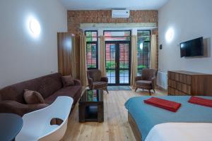 Postelja oz. postelje v sobi nastanitve Wine Inn Borjomi Aparthotel
