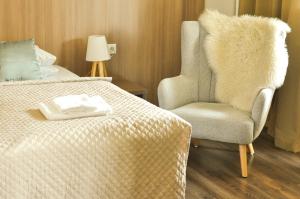 Postel nebo postele na pokoji v ubytování Hotel Garni