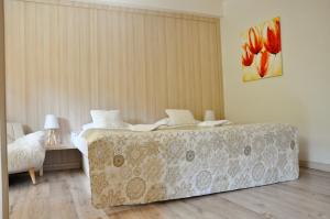 Postel nebo postele na pokoji v ubytování Hotel Garni