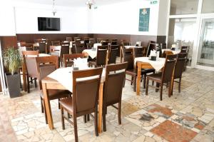 TV a/nebo společenská místnost v ubytování Hotel Garni