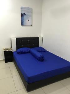 Katil atau katil-katil dalam bilik di Tuah Homestay Damai
