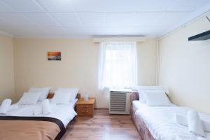 Posteľ alebo postele v izbe v ubytovaní Bier-Lak Apartman House 71