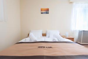 Posteľ alebo postele v izbe v ubytovaní Bier-Lak Apartman House 71