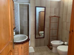 Koupelna v ubytování Arega B&B + 8 fotografií