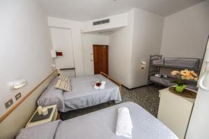 Postel nebo postele na pokoji v ubytování Hotel Caesar