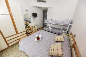 Postel nebo postele na pokoji v ubytování Hotel Caesar