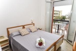Postel nebo postele na pokoji v ubytování Hotel Caesar