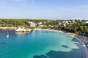 an aerial view of a beach with boats in the water at ARTIEM Audax - Adults Only in Cala Galdana