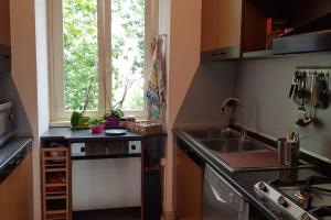 a small kitchen with a sink and a window at A casa di Juno in Rome