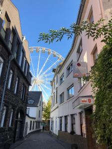 a ferris wheel in the middle of a street at Gasthaus Stammbaum in Andernach