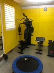 a room with a gym with a gym equipment at Le Papillon in Le Moule