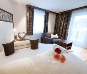 Postel nebo postele na pokoji v ubytování Hotel Jennys Schlössl