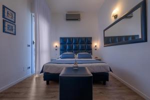 Letto o letti in una camera di Hotel Rombino