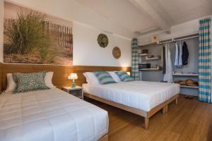 Кровать или кровати в номере Lino delle Fate Eco Resort