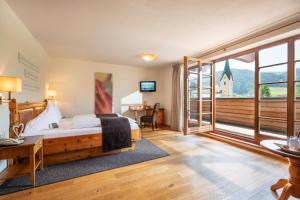 Posteľ alebo postele v izbe v ubytovaní Hotel Walchseer Hof