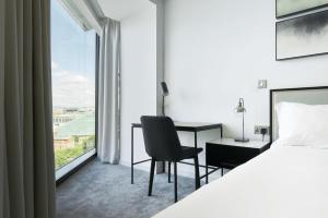 CitySuites Aparthotel客房内的一张或多张床位