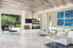A television and/or entertainment centre at Aloni Villa - Contemporary Villa with Private Pool & Sea Views, Fiskardo