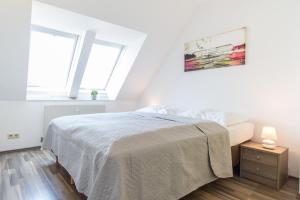 Postel nebo postele na pokoji v ubytování Karmeliter Flat | contactless check-in
