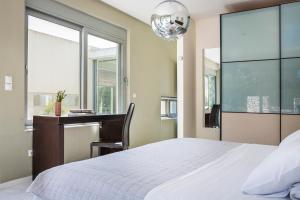 A bed or beds in a room at Aloni Villa - Contemporary Villa with Private Pool & Sea Views, Fiskardo