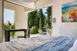 A bed or beds in a room at Aloni Villa - Contemporary Villa with Private Pool & Sea Views, Fiskardo