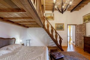 Posteľ alebo postele v izbe v ubytovaní Appartamento stile toscano in Fauglia + 15 fotografií