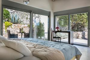 A bed or beds in a room at Aloni Villa - Contemporary Villa with Private Pool & Sea Views, Fiskardo