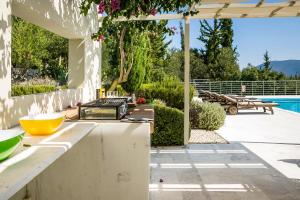 The swimming pool at or close to Aloni Villa - Contemporary Villa with Private Pool & Sea Views, Fiskardo