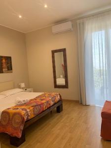 Postel nebo postele na pokoji v ubytování B&B Villa Etelka