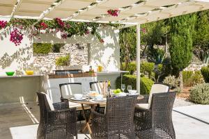 A garden outside Aloni Villa - Contemporary Villa with Private Pool & Sea Views, Fiskardo