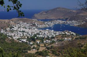 a view of a small town on a hill at Effie Hotel in Skala