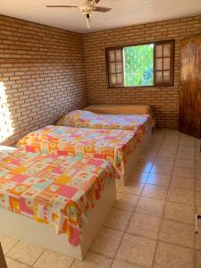 Uma cama ou camas num quarto em Casa na Praia - Parkrio Sauaçuhy - Maceió - AL