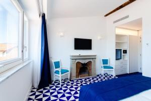 TV a/nebo společenská místnost v ubytování Maison Blu - Intimate GuestHouse