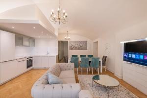 a living room with a couch and a table at Apartment in Old Town Lai street in Tallinn