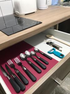 a group of utensils sitting on top of a table at Lancaster Place Apartments in Leicester