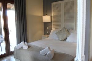 Postel nebo postele na pokoji v ubytování Hotel Magdalena