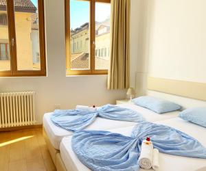 Posteľ alebo postele v izbe v ubytovaní Argentieri Guesthouse