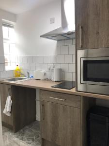Kuchyň nebo kuchyňský kout v ubytování Lancaster Place Apartments
