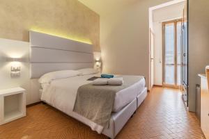 Postel nebo postele na pokoji v ubytování Hotel Albatros