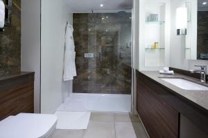 a bathroom with a shower and a toilet and a sink at Sir Christopher Wren Hotel in Windsor