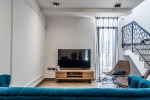 Телевизия и/или развлекателен център в Casa Calma - Modern house with panoramic sea view