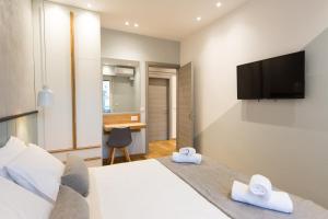TV a/nebo společenská místnost v ubytování Pleasant Stay