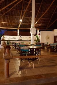 A restaurant or other place to eat at Neptune Village Beach Resort & Spa - All Inclusive
