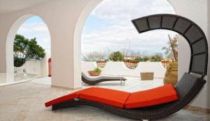 a couch in a living room with a view at Villa Lulu in Schiavonea