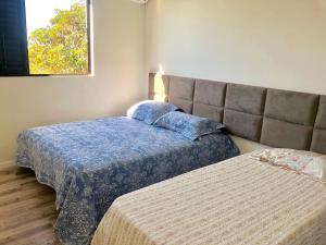 Katil atau katil-katil dalam bilik di Apartamento Condominio Maria Isabel