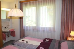 Postel nebo postele na pokoji v ubytování Haus Pan