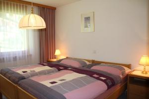 Postel nebo postele na pokoji v ubytování Haus Pan